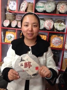 Shopkeeper holding Pu'er tea